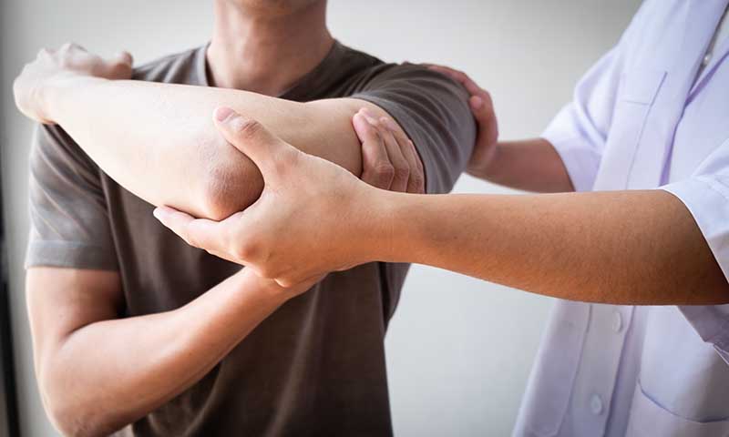 Therapist,Treating,A,Male,Injured,By,Rotator,Cuff,Stretching,Method,